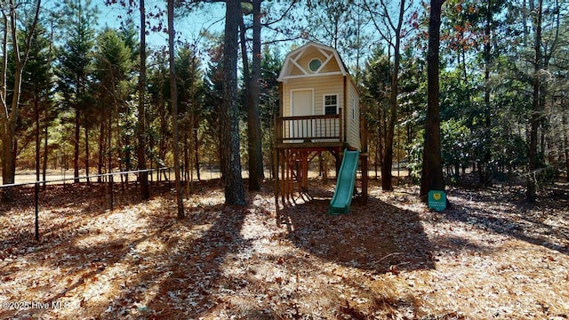 view of jungle gym with fence