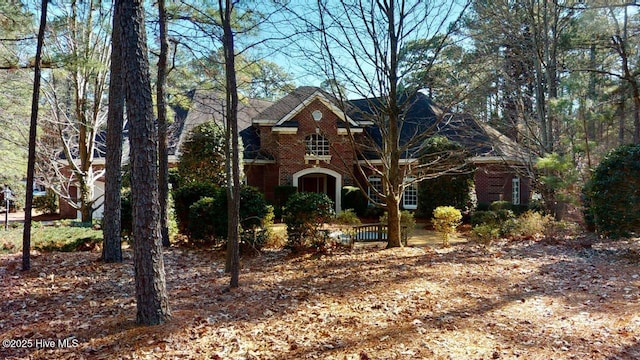 view of front of house with brick siding
