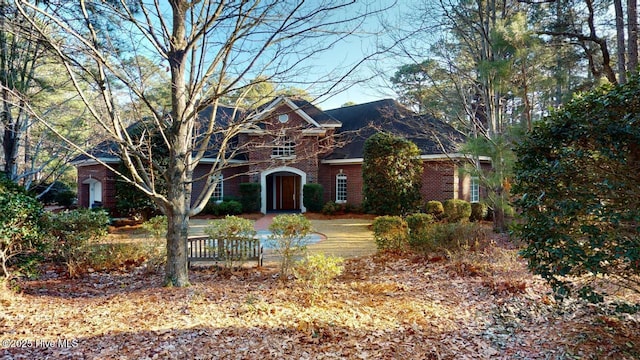 view of front of home featuring brick siding