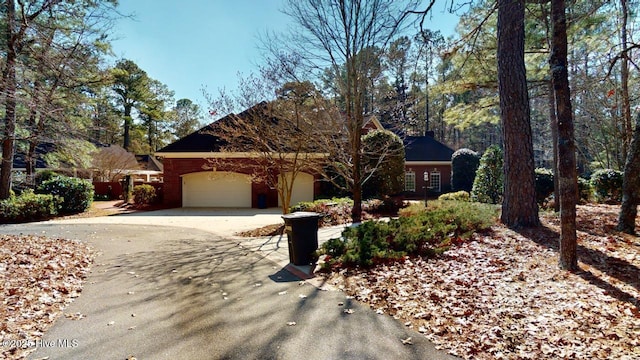view of front of house featuring an attached garage and driveway