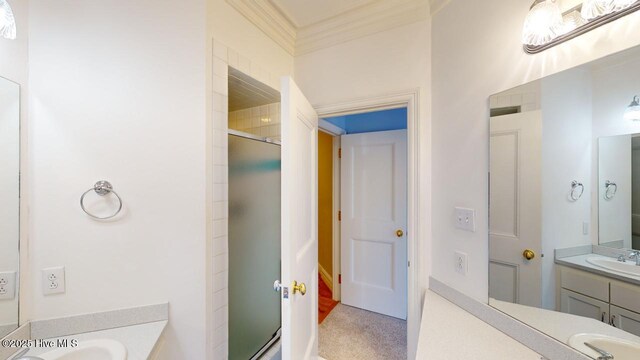 bathroom with a stall shower and vanity