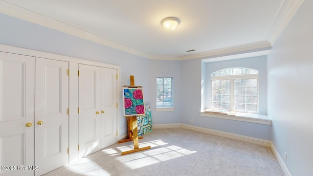unfurnished bedroom featuring carpet, baseboards, visible vents, crown molding, and two closets