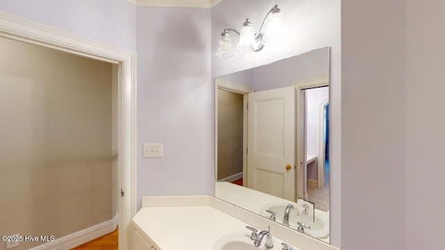 bathroom with vanity and baseboards
