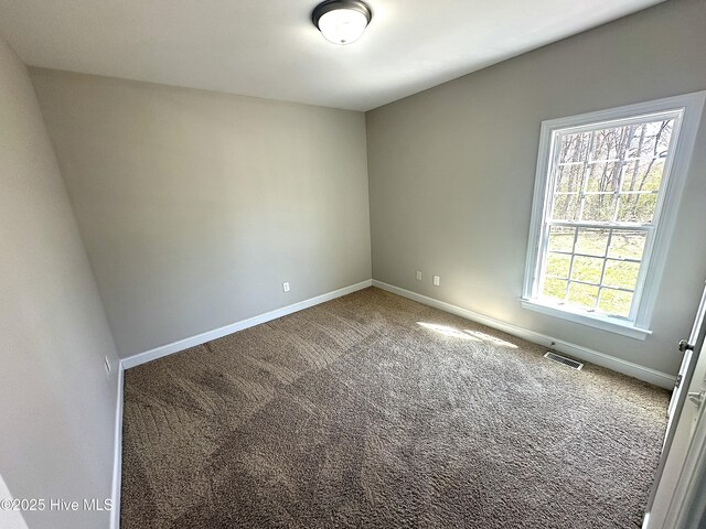 8107 Gentle Breeze Dr, Sims, NC 27880 - empty room with visible vents, carpet floors, and baseboards