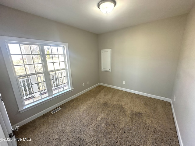 8107 Gentle Breeze Dr, Sims, NC 27880 - spare room featuring visible vents, carpet, and baseboards