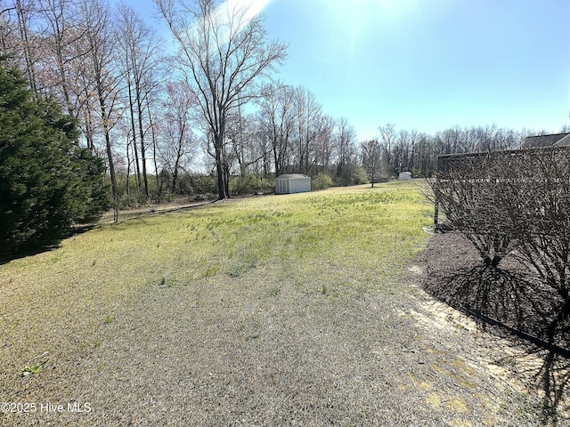 8107 Gentle Breeze Dr, Sims, NC 27880 - view of yard featuring an outbuilding and a shed