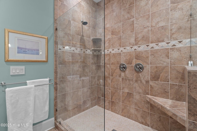 full bath with a tile shower