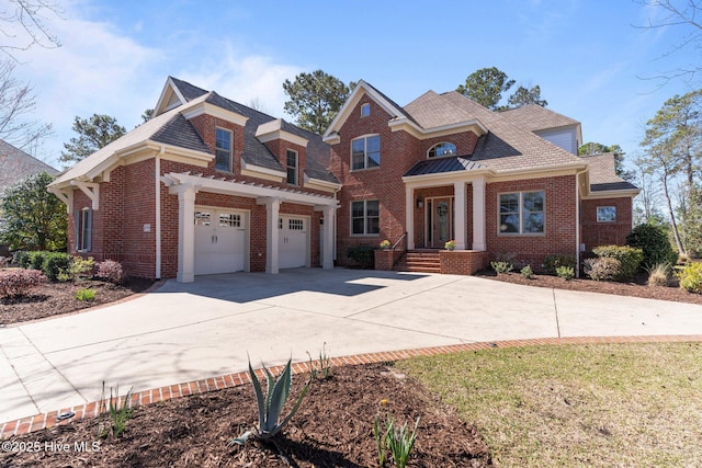 view of front of house featuring brick siding, concrete driveway, and a garage