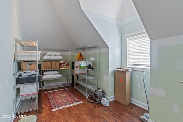 bedroom featuring wood finished floors and baseboards