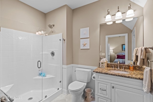 6790 Waterstone Xing SW, Ocean Isle Beach, NC 28469 - ensuite bathroom featuring a stall shower, vanity, wainscoting, and tile patterned floors