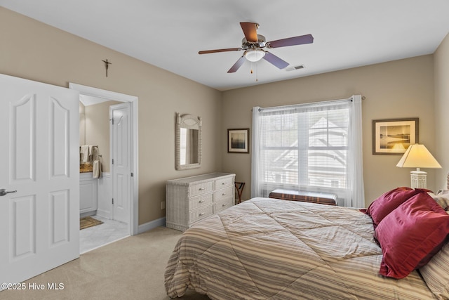 bedroom with visible vents, light carpet, ensuite bath, baseboards, and ceiling fan