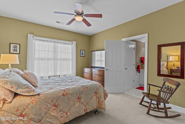 carpeted bedroom featuring visible vents, baseboards, and ceiling fan