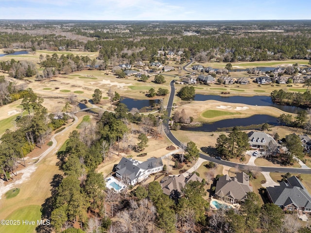 drone / aerial view featuring a residential view, a water view, and view of golf course