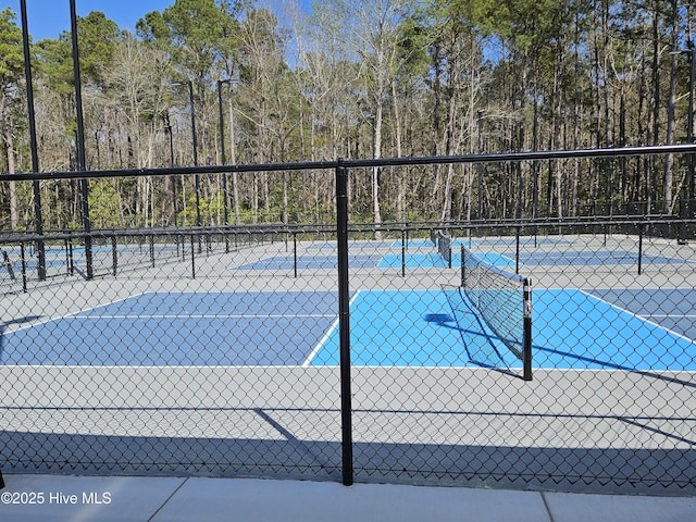 view of sport court with fence