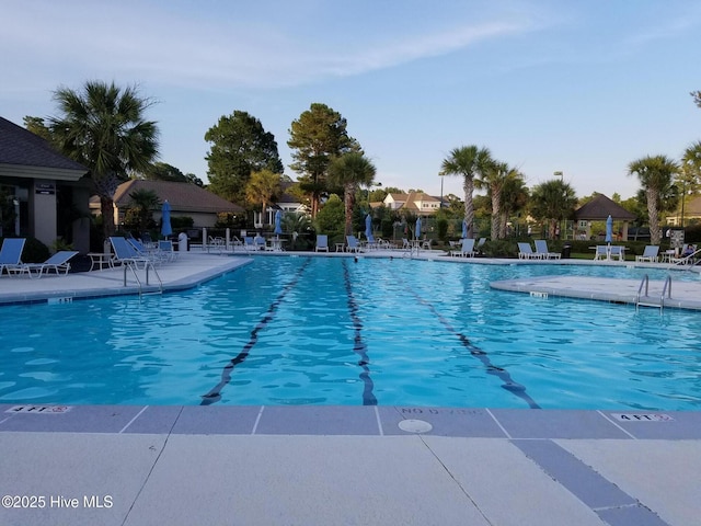 pool featuring a patio and fence