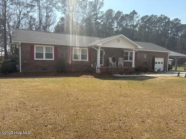 single story home with a porch, an attached garage, a front lawn, crawl space, and brick siding