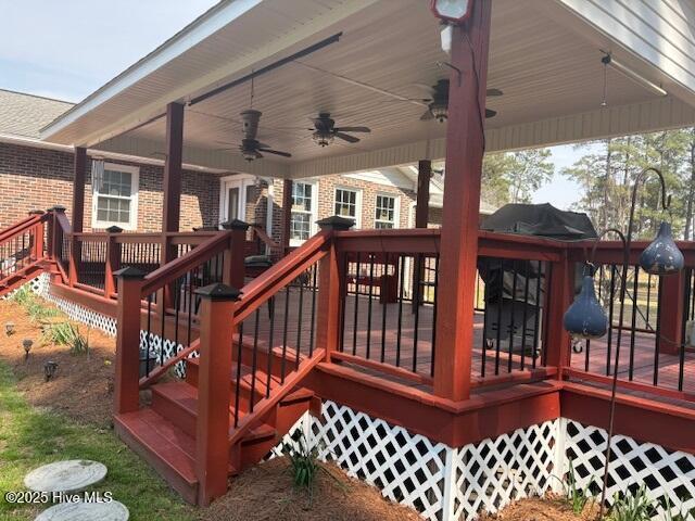 wooden terrace with stairs and ceiling fan