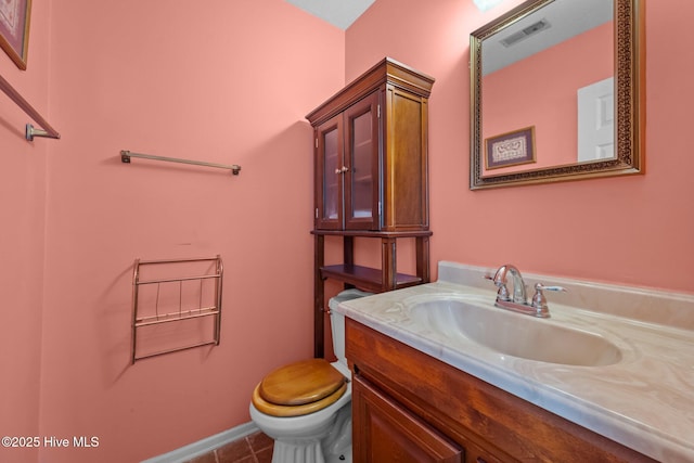 bathroom with vanity, tile patterned floors, toilet, and visible vents