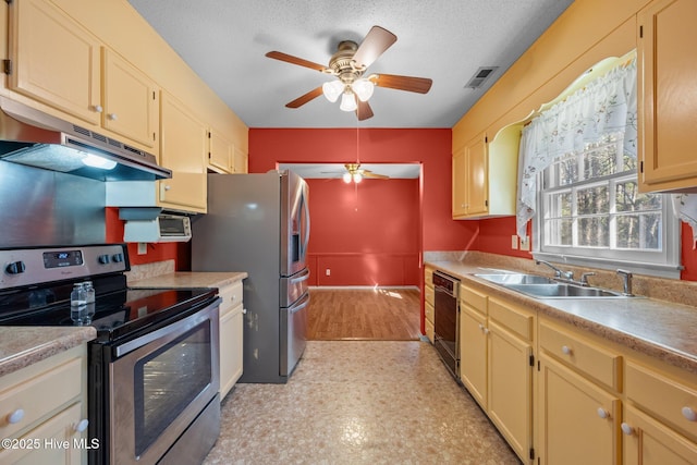 kitchen with visible vents, ceiling fan, a sink, under cabinet range hood, and appliances with stainless steel finishes