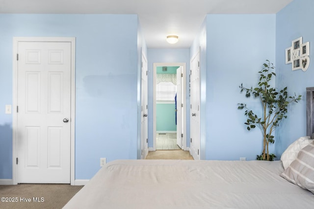 bedroom featuring carpet flooring and baseboards