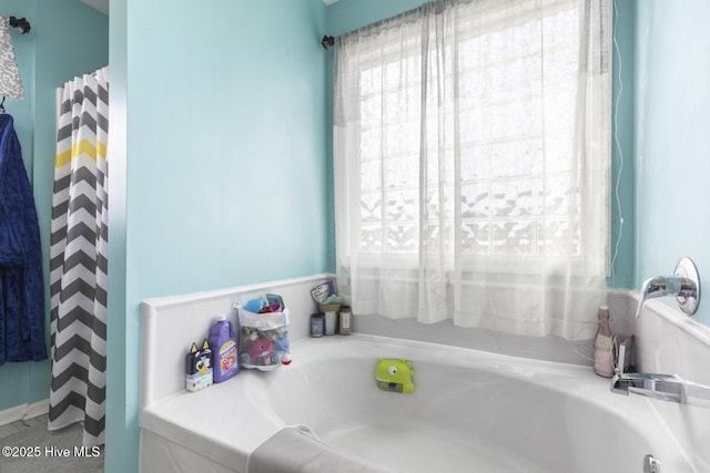 full bathroom with a garden tub