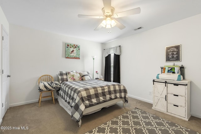 carpeted bedroom featuring baseboards, visible vents, and ceiling fan