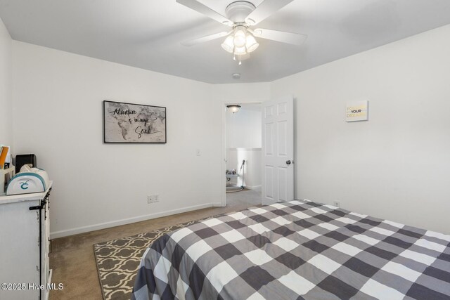 carpeted bedroom featuring baseboards and a ceiling fan