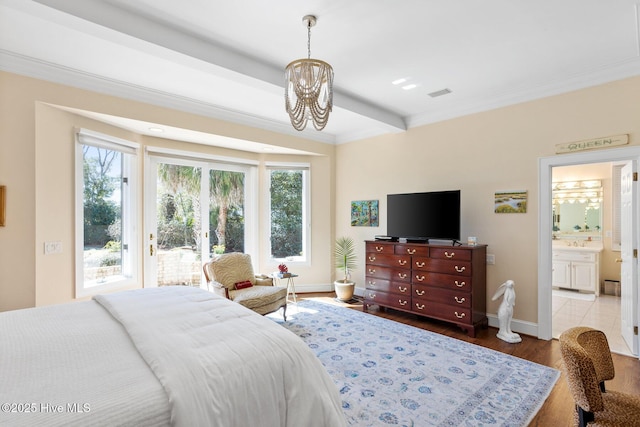 bedroom featuring wood finished floors, a chandelier, baseboards, access to outside, and visible vents
