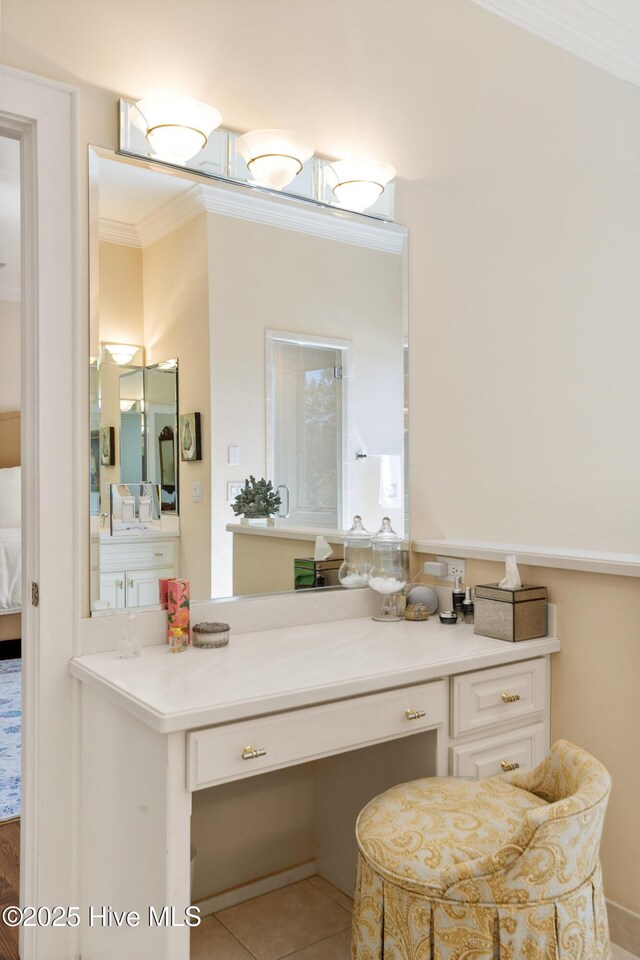 bathroom featuring tile patterned floors, ensuite bathroom, vanity, and crown molding