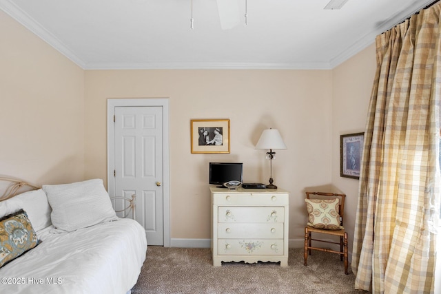 bedroom featuring baseboards, ornamental molding, and carpet flooring