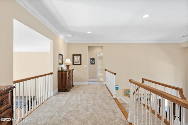 hall featuring recessed lighting, carpet floors, an upstairs landing, and ornamental molding