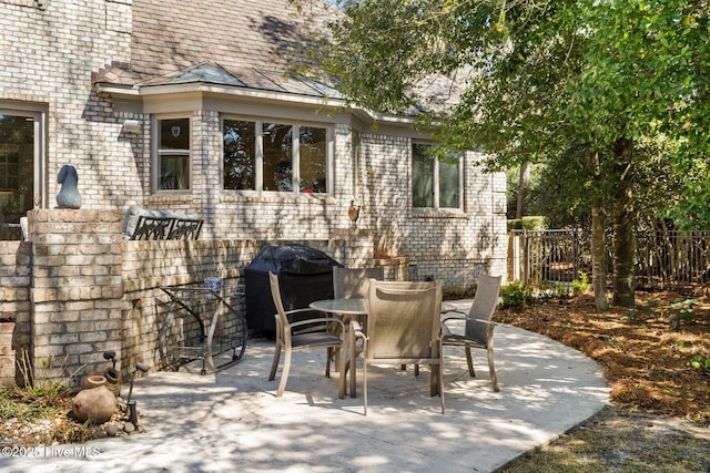 1806 Odyssey Dr, Wilmington, NC 28405 - view of patio / terrace with a grill and outdoor dining space