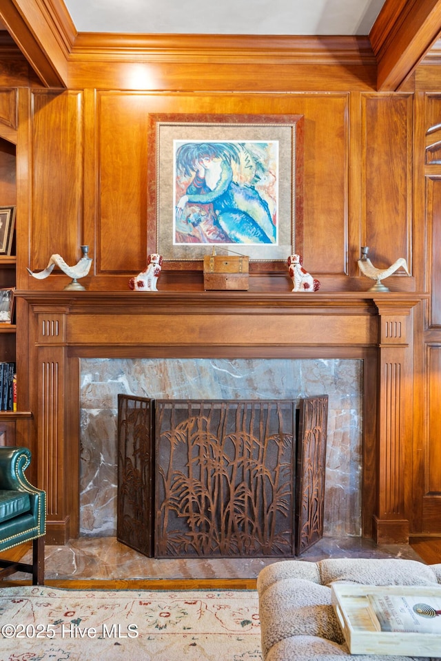 interior details with crown molding and wood walls