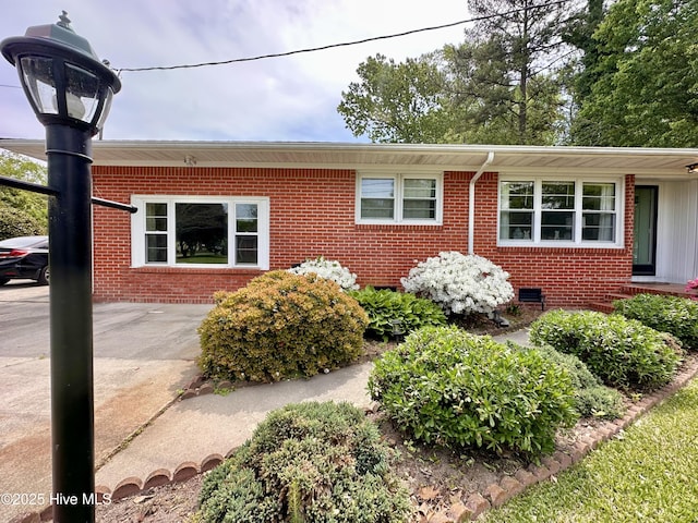 view of property exterior featuring brick siding