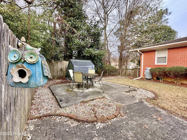 view of patio / terrace featuring outdoor dining space and a fenced backyard