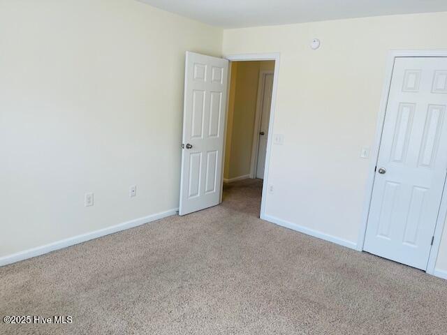 305 Comanche Trl, Havelock, NC 28532 - unfurnished bedroom with carpet and baseboards