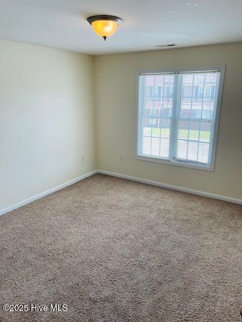 305 Comanche Trl, Havelock, NC 28532 - unfurnished room with carpet floors and baseboards