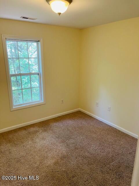 305 Comanche Trl, Havelock, NC 28532 - empty room featuring carpet and baseboards