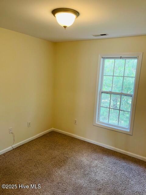 305 Comanche Trl, Havelock, NC 28532 - empty room with carpet and baseboards