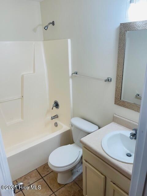 305 Comanche Trl, Havelock, NC 28532 - bathroom featuring vanity, toilet, shower / bathtub combination, and tile patterned floors