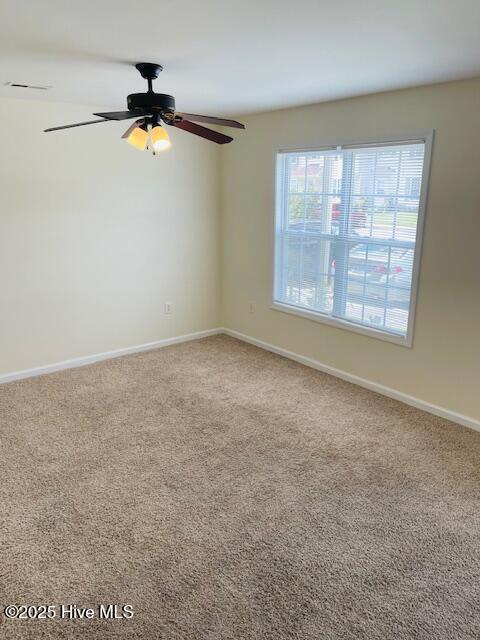 305 Comanche Trl, Havelock, NC 28532 - empty room with carpet, ceiling fan, and baseboards