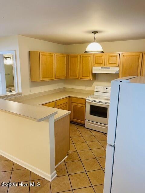305 Comanche Trl, Havelock, NC 28532 - kitchen featuring white appliances, under cabinet range hood, light tile patterned floors, a peninsula, and light countertops