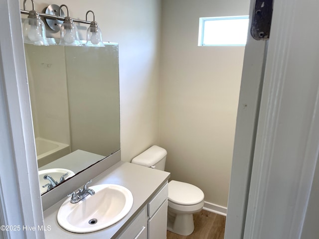 142 Witten Cir Unit A, Havelock, NC 28532 - full bathroom featuring toilet, vanity, wood finished floors, and baseboards