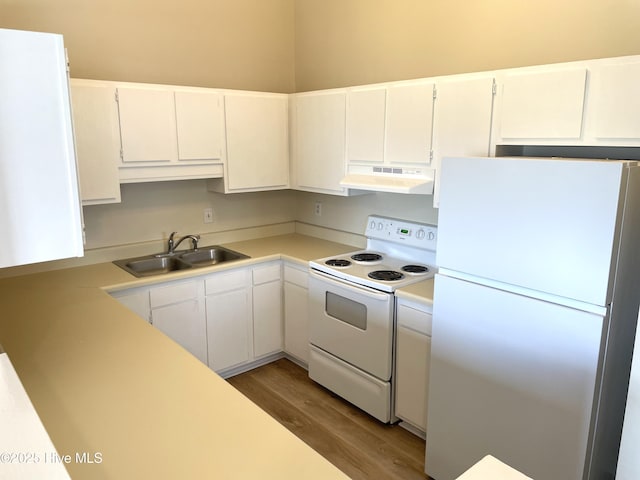 142 Witten Cir Unit A, Havelock, NC 28532 - kitchen featuring white appliances, under cabinet range hood, a sink, light wood-style floors, and light countertops