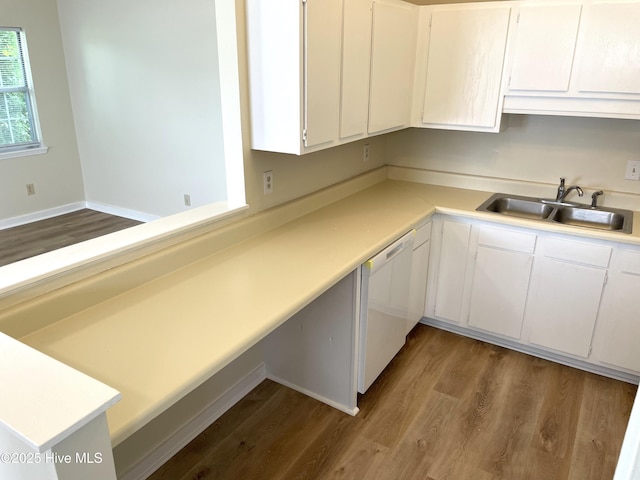 142 Witten Cir Unit A, Havelock, NC 28532 - kitchen featuring white dishwasher, a sink, light countertops, and dark wood-style flooring