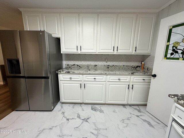 13280 Blues Farm Rd, Laurinburg, NC 28352 - kitchen featuring a sink, stainless steel appliances, backsplash, white cabinets, and light stone countertops