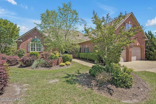 1061 Leesburg Dr, Leland, NC 28451 - view of front of property featuring brick siding, driveway, a front yard, and a garage