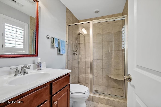 1061 Leesburg Dr, Leland, NC 28451 - full bath with a shower stall, toilet, vanity, and visible vents