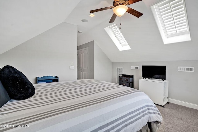 1061 Leesburg Dr, Leland, NC 28451 - carpeted bedroom featuring vaulted ceiling with skylight, visible vents, baseboards, and ceiling fan