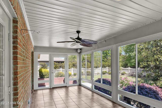 1061 Leesburg Dr, Leland, NC 28451 - unfurnished sunroom featuring brick wall, tile patterned flooring, and ceiling fan